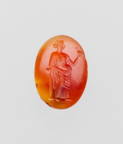 Greek, Carnelian oval with woman holding a dove, 2nd-1st century BC.