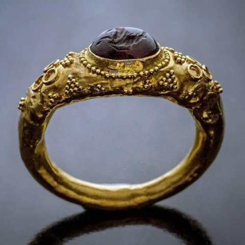Ancient Roman gold ring, circa 1st century AD.
This hollow gold ring (approximately 21K) is bezel-set with a garnet intaglio of a Hippocamp – a fish-tailed horse that was considered the horse of Po