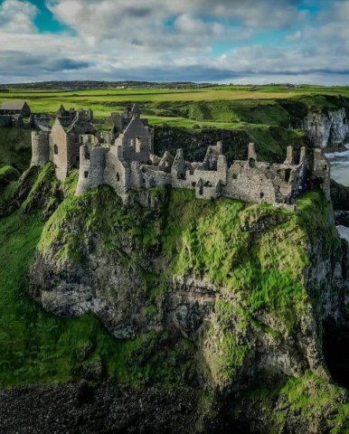 Dunluce Castle, built around the late Middle Ages. The last image in the series shows how it would've looked in its prime. Ireland.