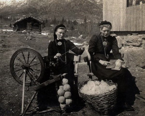 Two Women Carding and Spinning Wool, Norway (c. 1905).
