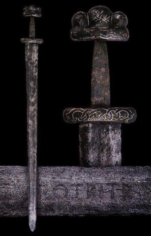 Viking Age sword with gold and silver inlaid ornaments found in Denmark.