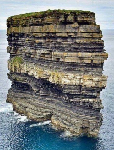 This is Dún Briste (literally Broken Fort) in Co. Mayo, Ireland. This 50 metres tall sea-stack stands just off Downpatrick Head, in the townland of Knockaun, east of the quiet village of Ballycastle.
